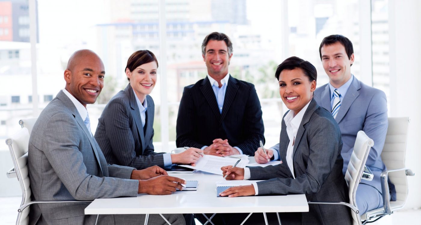 Diverse Group At A Conference Table Immigration Consulting