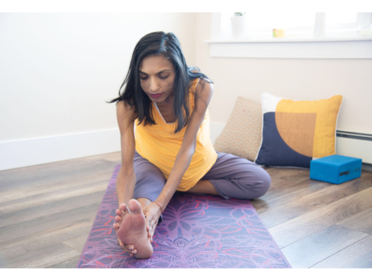 Girl Stretching Using Yoga Services