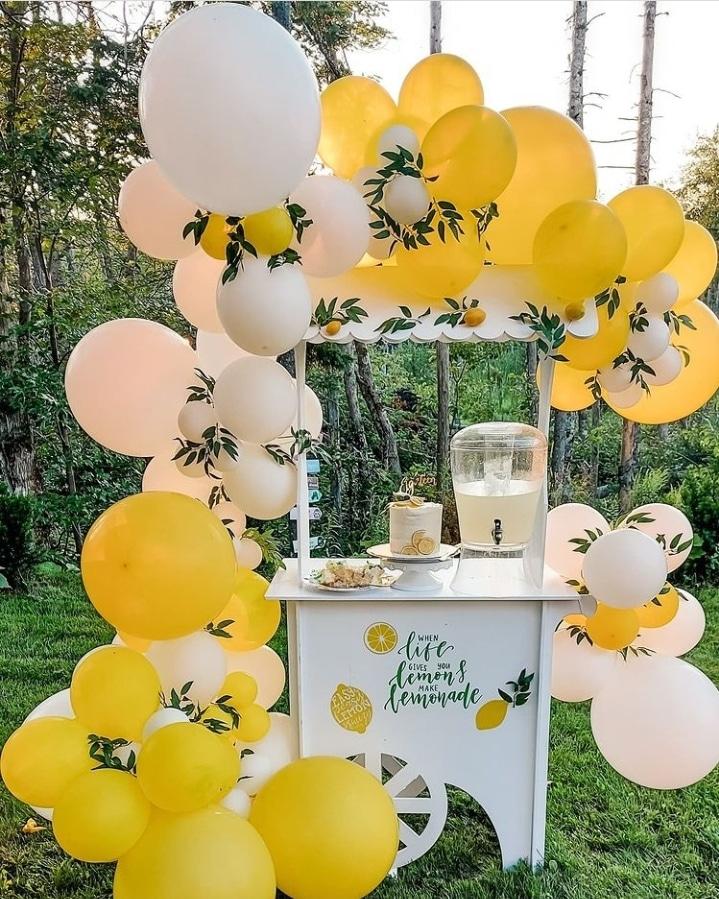 biodegradable balloon decor on lemonade stand