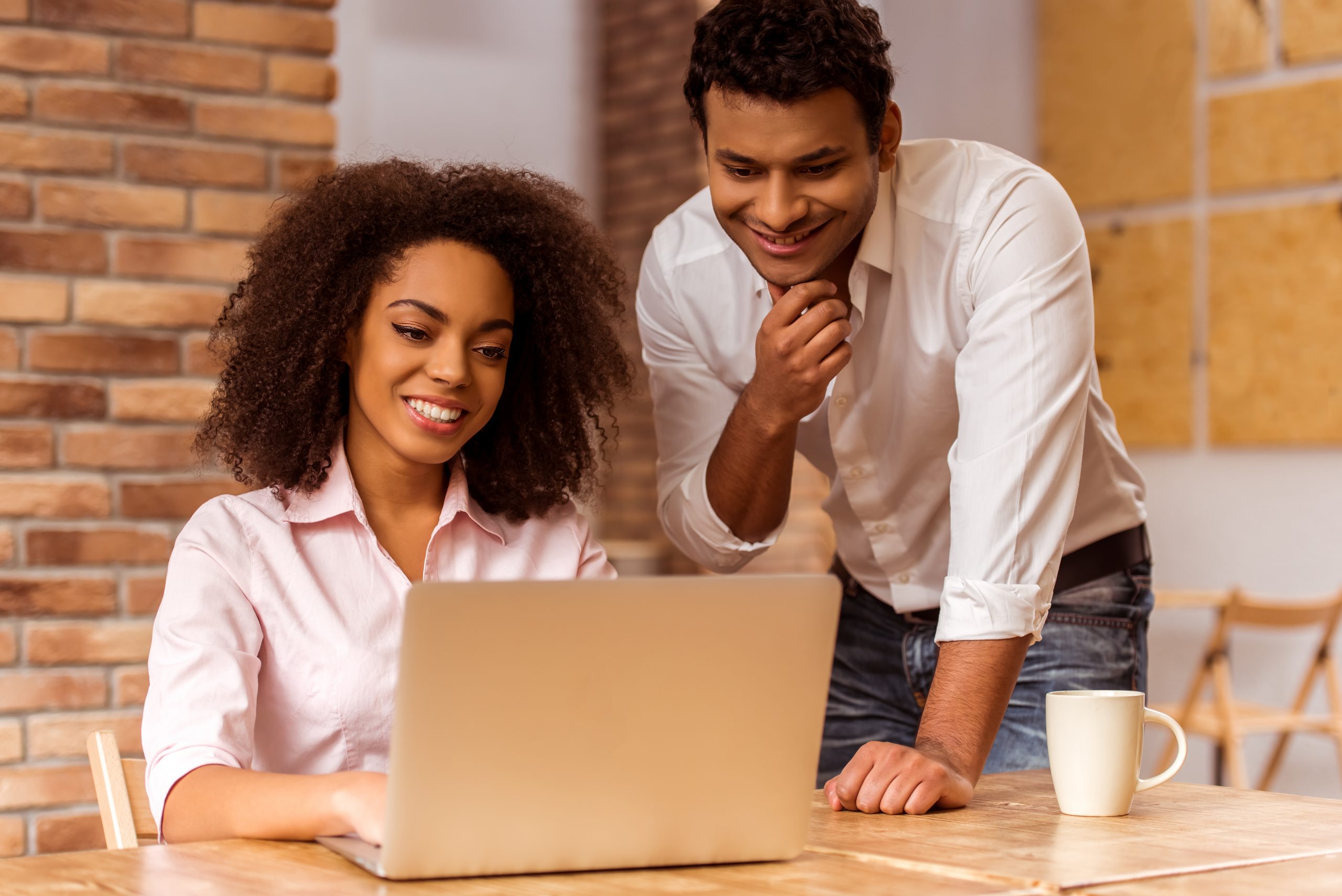 Happy black couple at laptop. vStore feature image Bordeleau CPA Personal Taxes