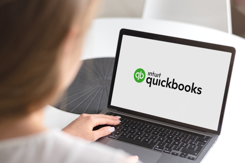 Quickbooks logo on female business owner's laptop. Sankofa Bookkeeping QuickBooks Training image